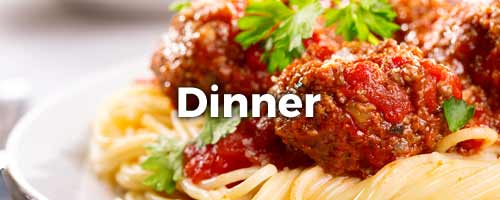 Spaghetti and meatballs with Dinner written on top of it